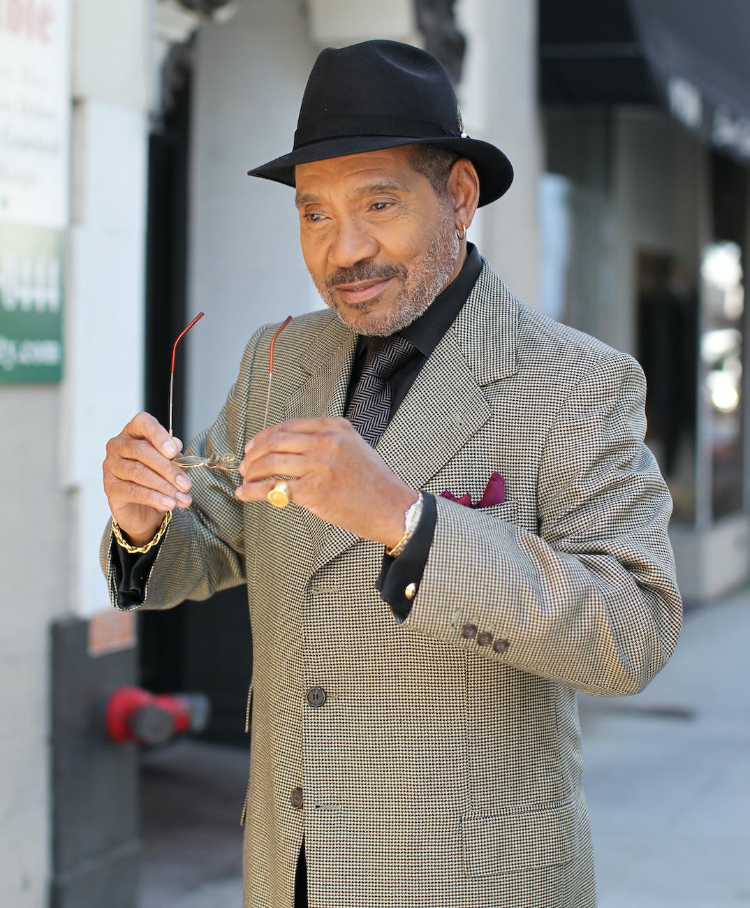 photo of a man wearing black fedora hat